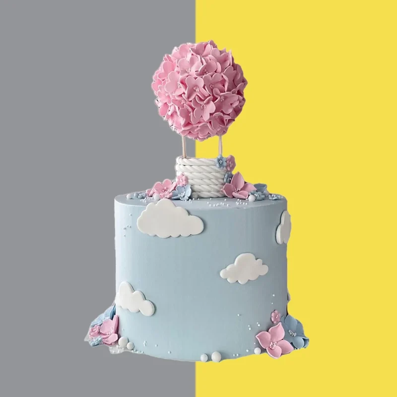 tarta con topper creativo de fondant, para revelación de género de bebé. de nuber , flores cesta y globo, diseño de Chef Jackeline.